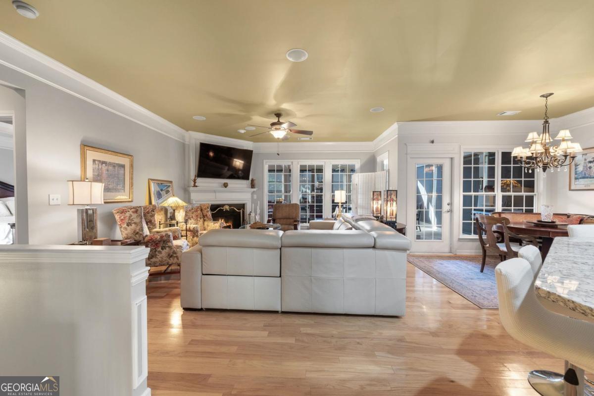 1151 Spring Station Road Greensboro, GA 30642 - Photo 10 of 60 a living room with fireplace furniture and a flat screen tv