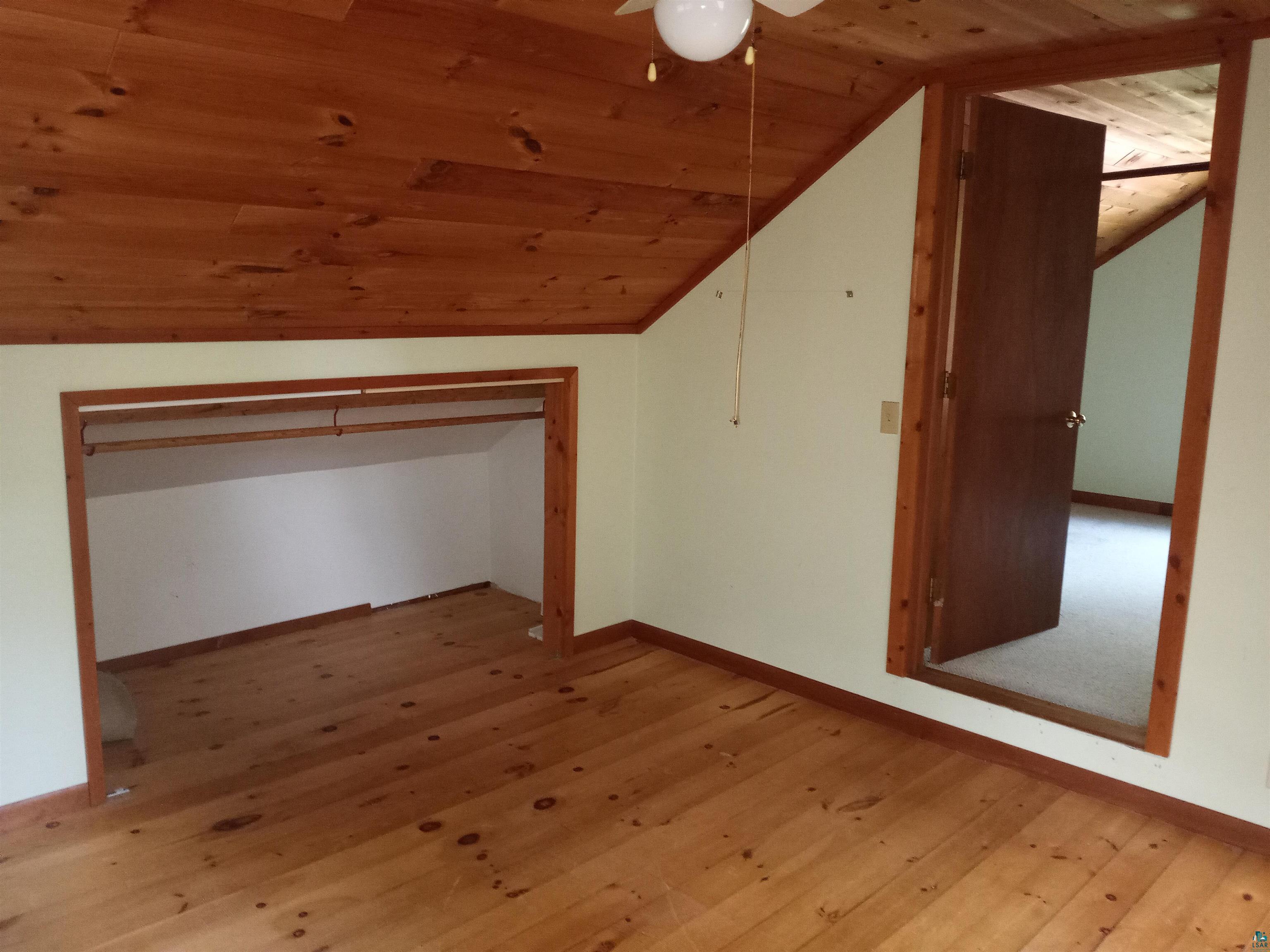 22715 Elm Street Cornucopia, WI 54827 - Photo 23 of 23 Loft Bedroom with storage area/closet