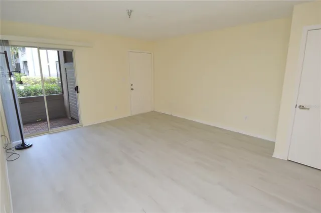 a bathroom with a granite countertop sink a mirror and a shower