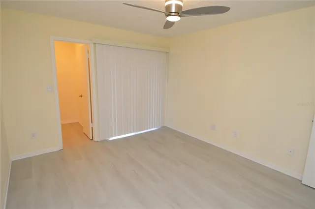 a view of a lake with houses in the background