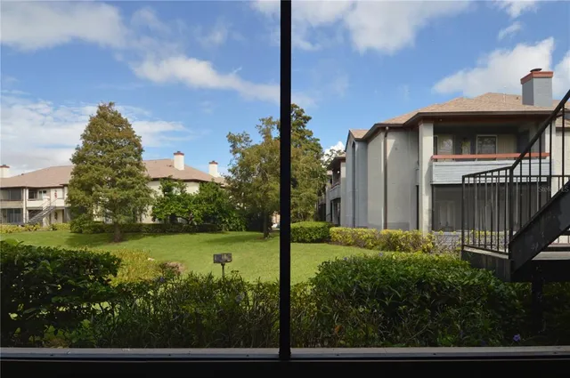 a view of a garden with swimming pool