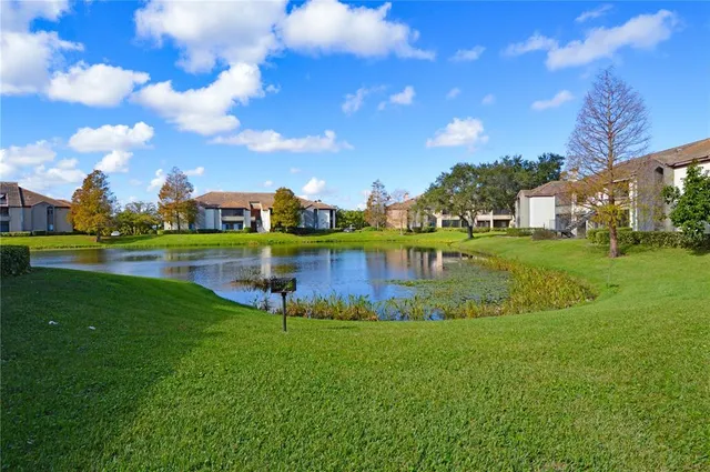 a view of a lake with houses in the background