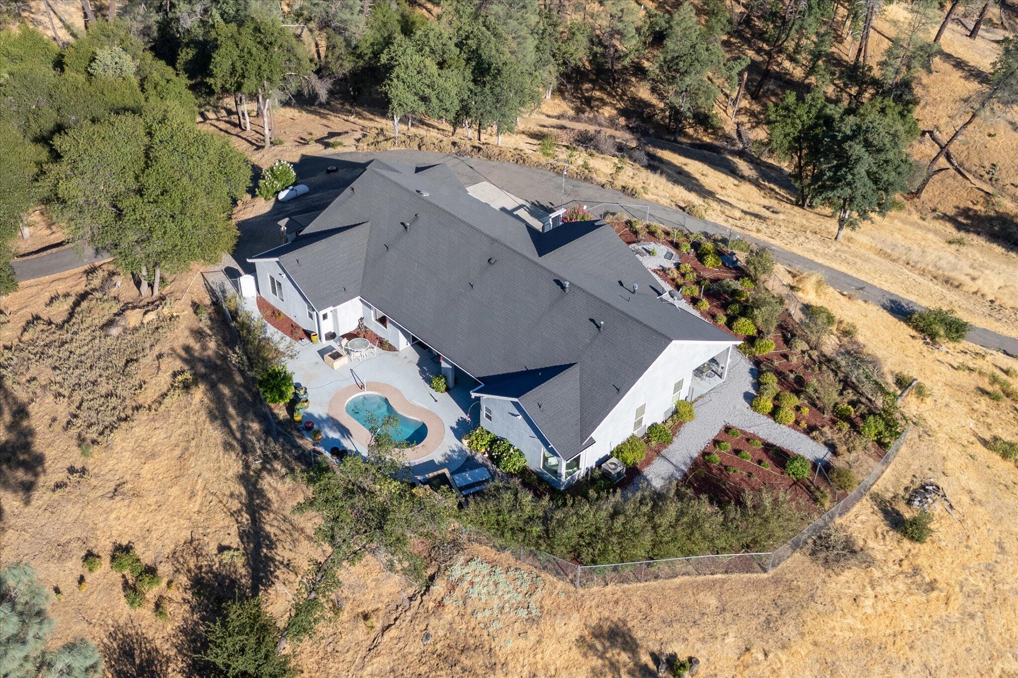 7870 Castle View Lane Redding, CA 96001 - Photo 2 of 65 an aerial view of a house with a yard