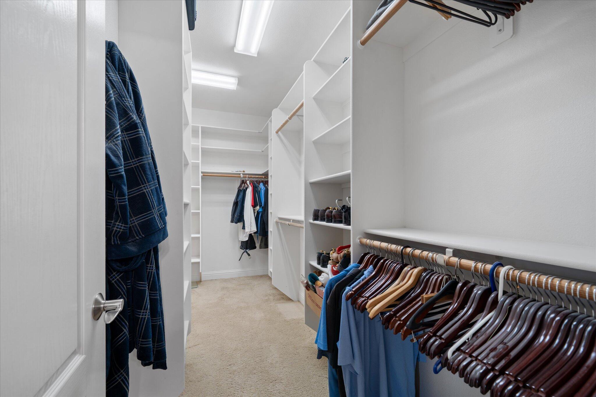7870 Castle View Lane Redding, CA 96001 - Photo 27 of 65 a view of walk in closet with clothes