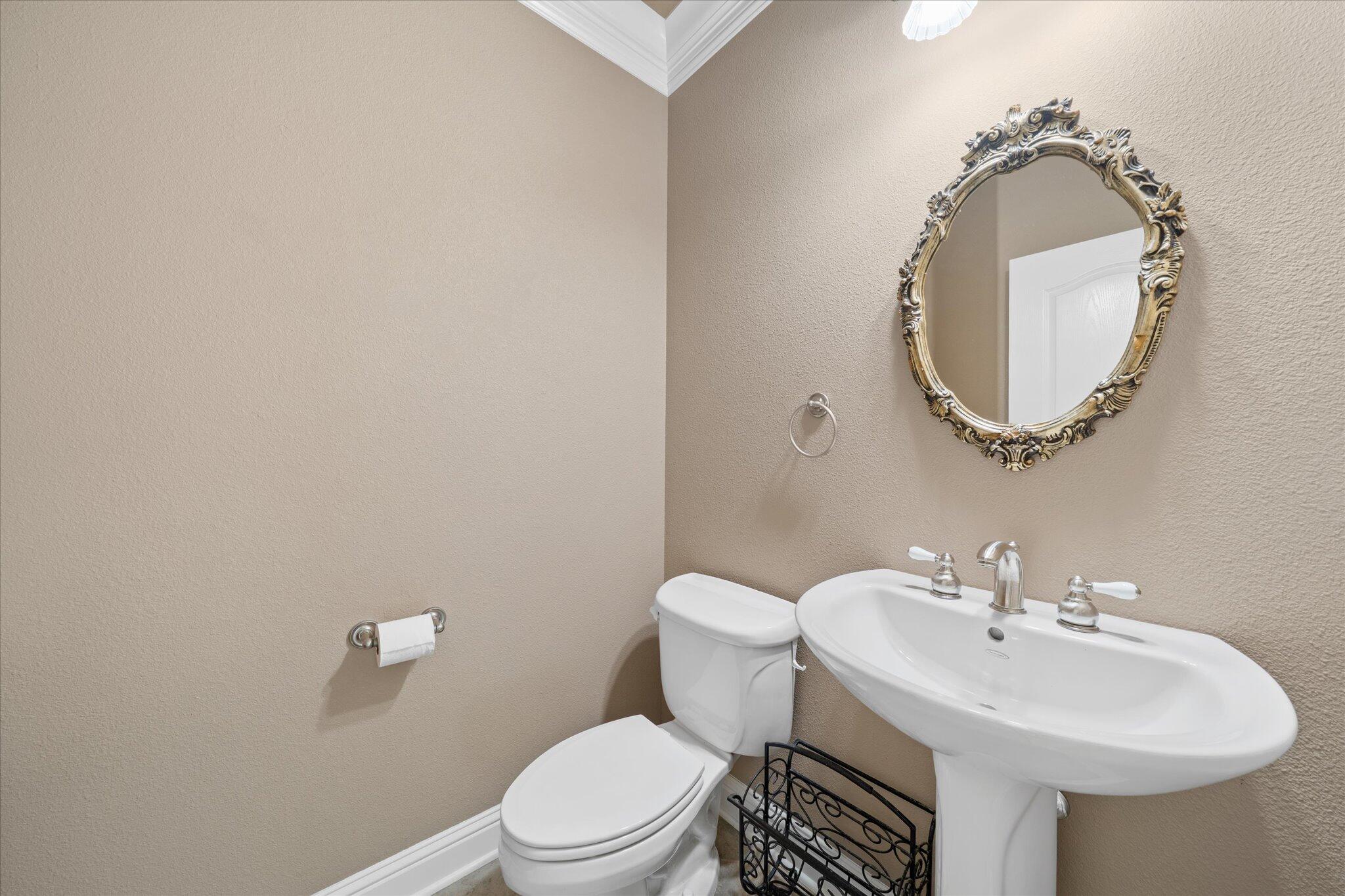 7870 Castle View Lane Redding, CA 96001 - Photo 36 of 65 a bathroom with a sink and a mirror