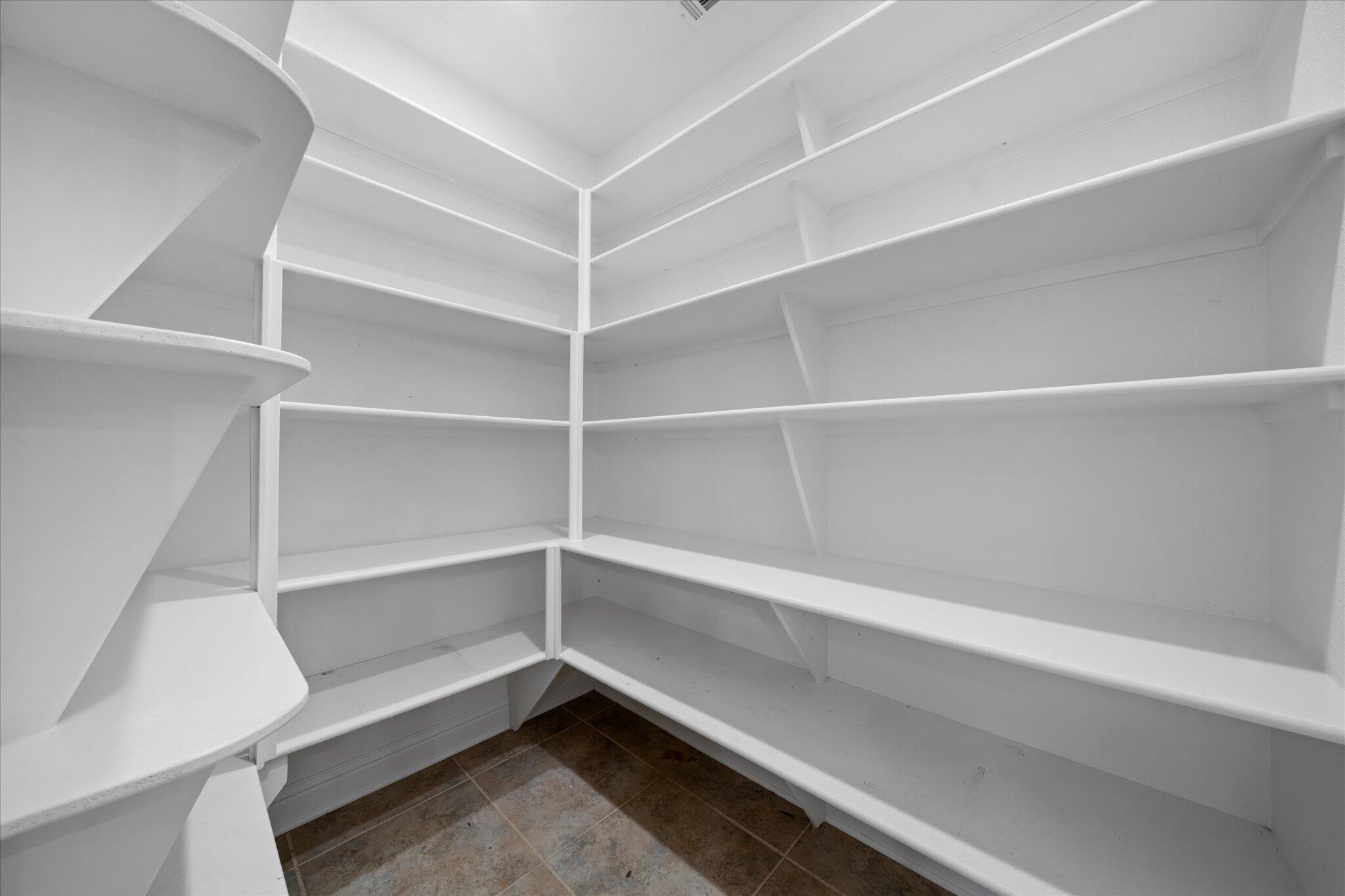 7870 Castle View Lane Redding, CA 96001 - Photo 37 of 65 a storage room with empty racks