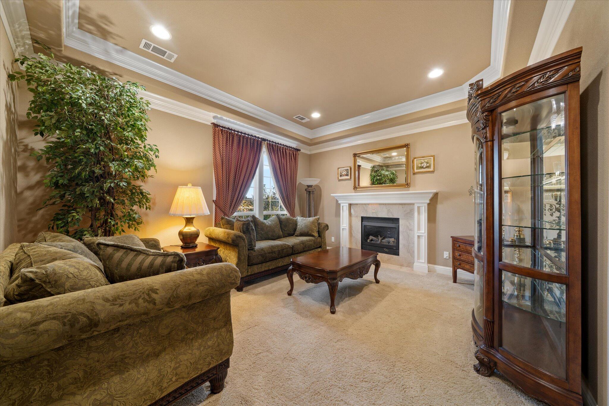 7870 Castle View Lane Redding, CA 96001 - Photo 4 of 65 a living room with furniture and a fireplace
