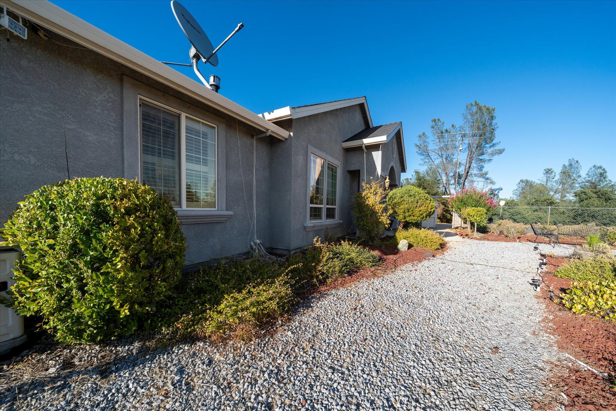 7870 Castle View Lane Redding, CA 96001 - Photo 49 of 65 a front view of a house with a yard