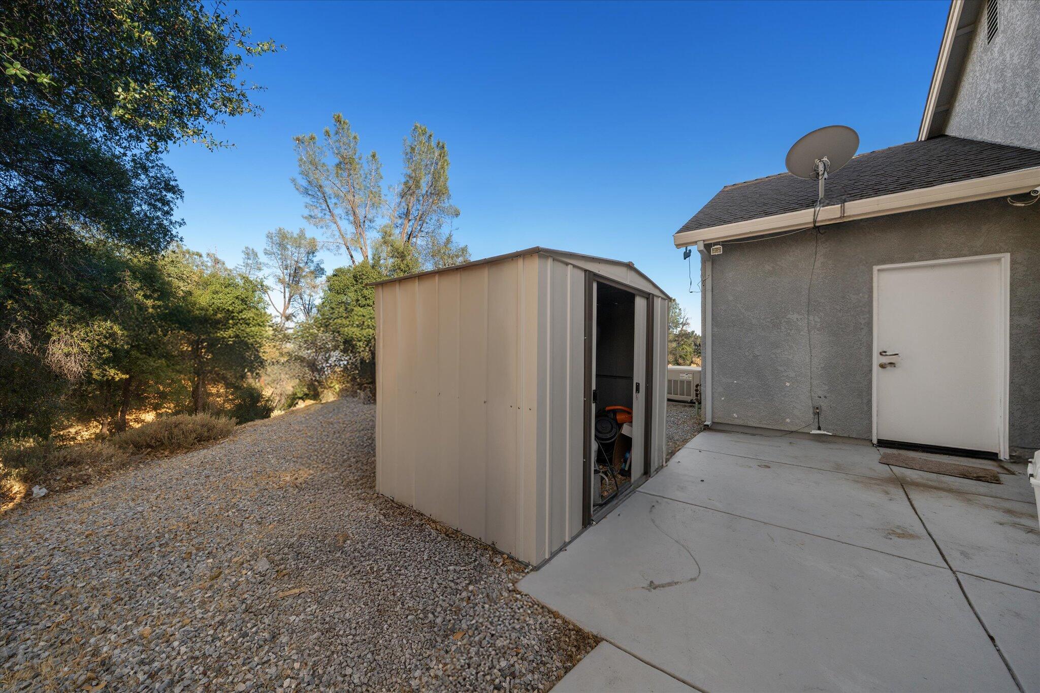 7870 Castle View Lane Redding, CA 96001 - Photo 51 of 65 a view of a garage with a sink