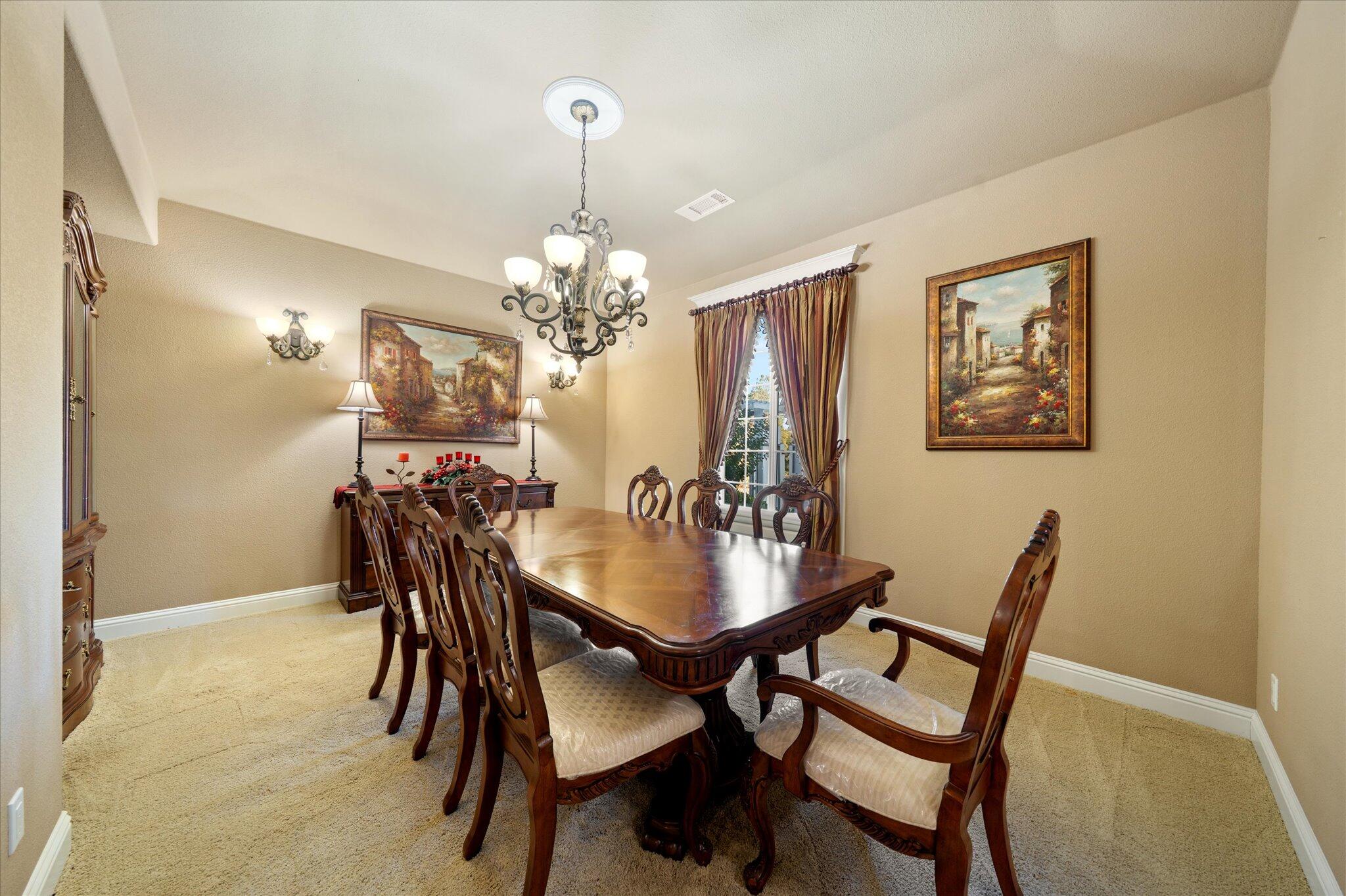 7870 Castle View Lane Redding, CA 96001 - Photo 9 of 65 a dining room with furniture and chandelier