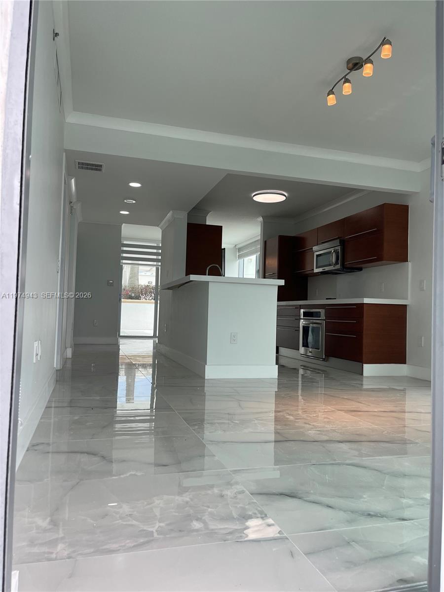 2681 North Flamingo Road, Unit 401S Sunrise, FL 33323 - Photo 6 of 18 a view of kitchen with furniture and window