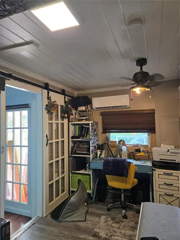 a outdoor space with lots of chairs and a projector