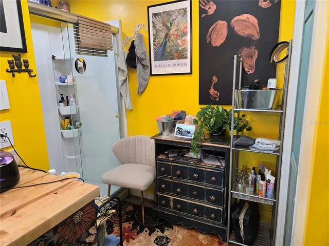 a front view of a house with outdoor seating