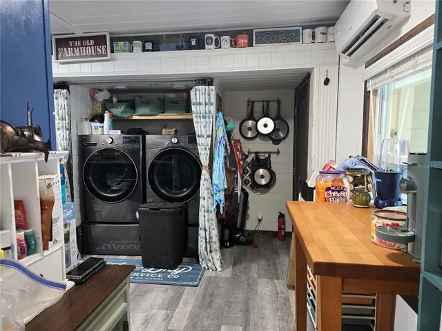 a view of a kitchen with fridge and rack