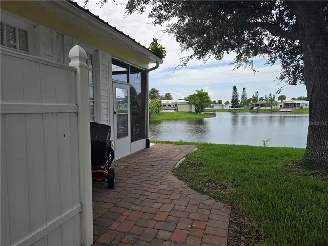 a view of a lake with a house in the background