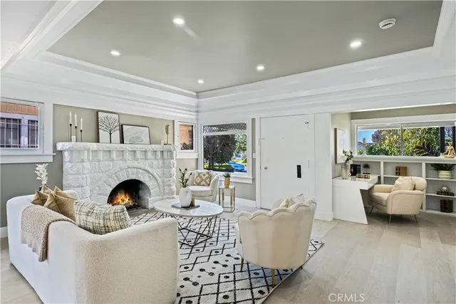 a living room with furniture and fireplace