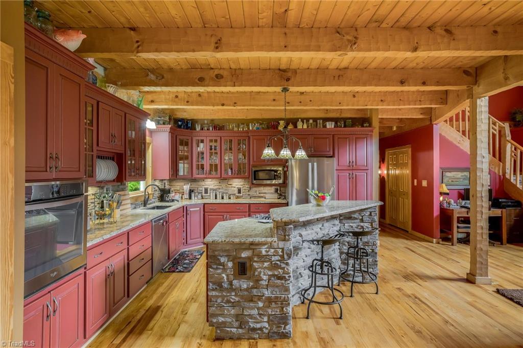 154 Rierson Road Madison, NC 27025 - Photo 11 of 30 Open kitchen with center island