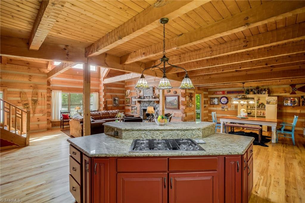 154 Rierson Road Madison, NC 27025 - Photo 12 of 30 View from kitchen. Kitchen island with gas cooktop that opens up to great room and dining room