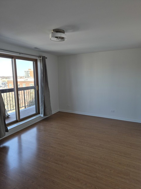 711 South River Road, Unit 704 Des Plaines, IL 60016 - Photo 7 of 15 a view of an empty room and window