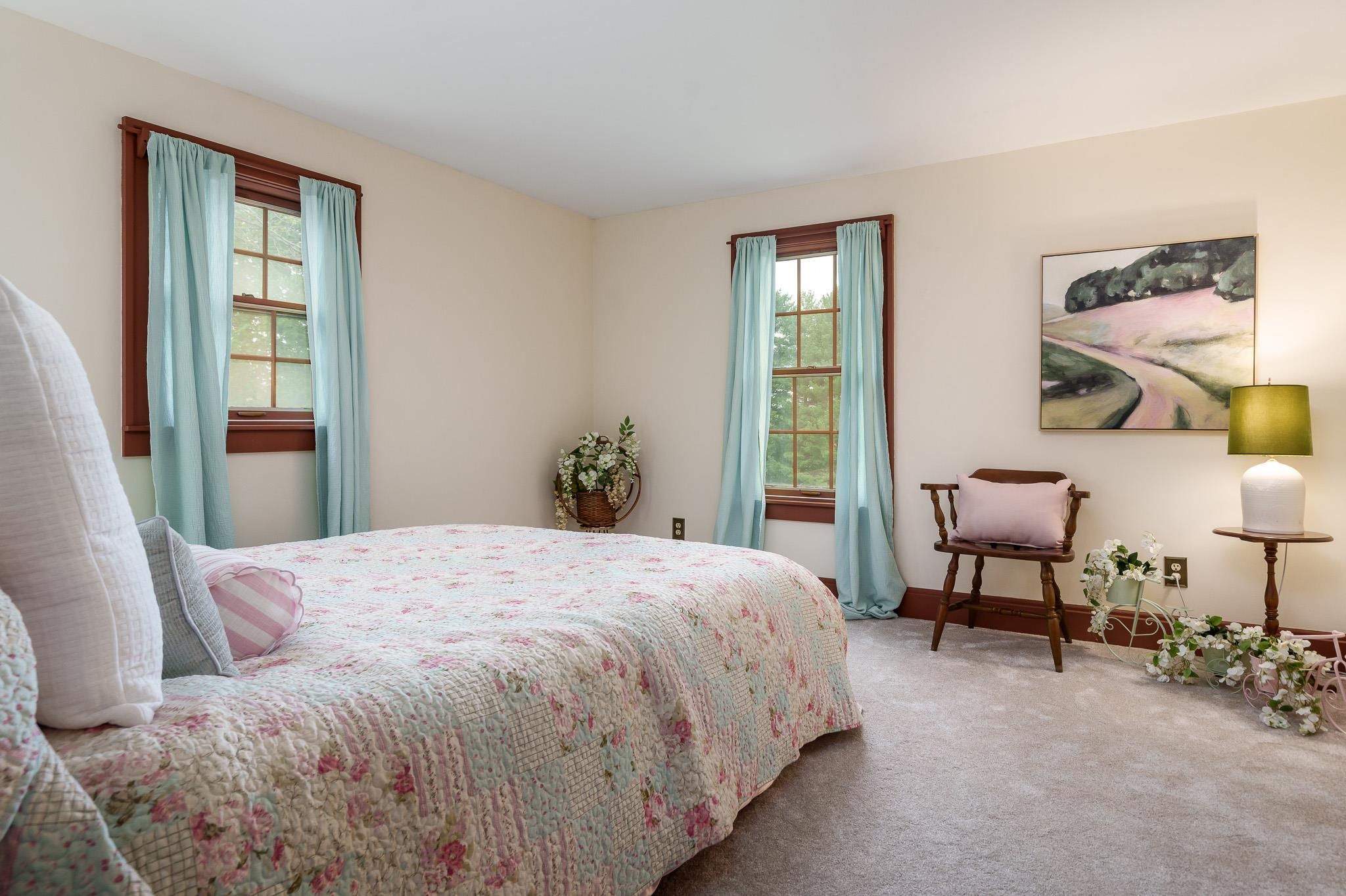 10562 Town Hall Road Belvidere, IL 61008 - Photo 43 of 72 a bedroom with a bed and a chair