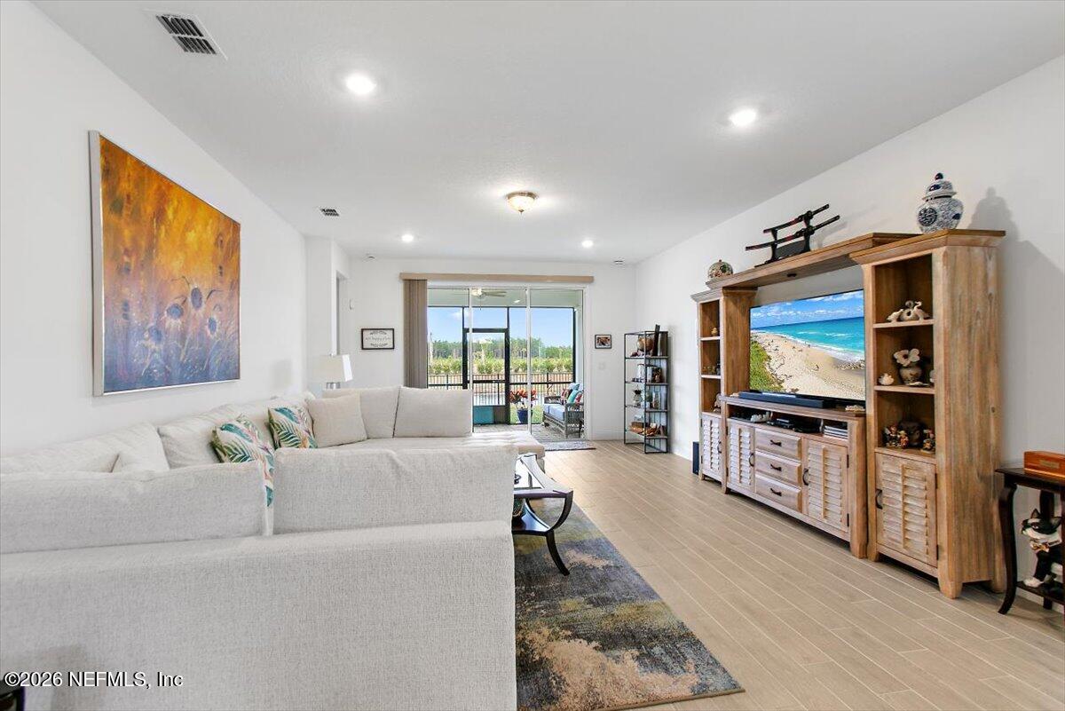 100 Simonson Run St. Augustine, FL 32092 - Photo 14 of 30 a living room with furniture and a flat screen tv
