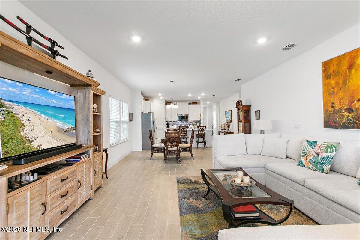 100 Simonson Run St. Augustine, FL 32092 - Photo 15 of 30 a living room with furniture and a flat screen tv