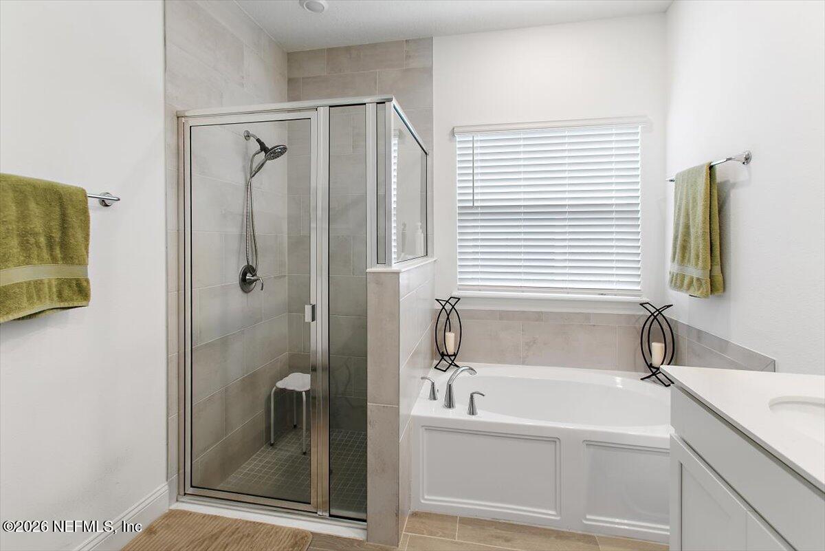 100 Simonson Run St. Augustine, FL 32092 - Photo 19 of 30 a bathroom with a bathtub and a shower