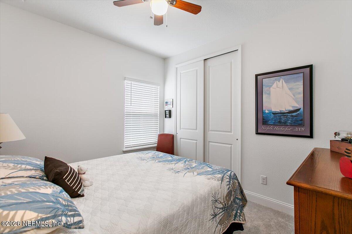100 Simonson Run St. Augustine, FL 32092 - Photo 21 of 30 a bedroom with a bed and a painting on the wall
