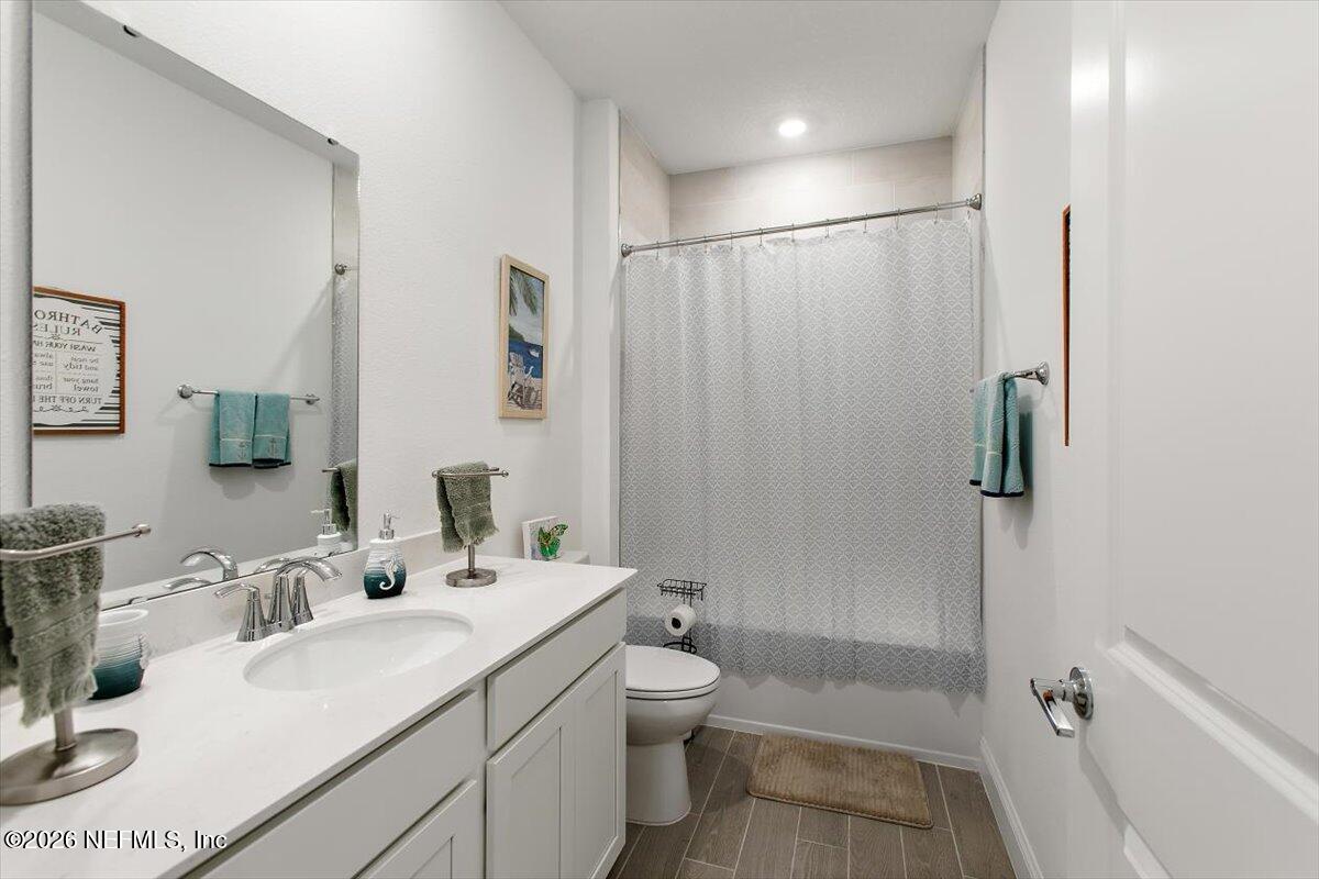 100 Simonson Run St. Augustine, FL 32092 - Photo 22 of 30 a bathroom with a sink a toilet and shower