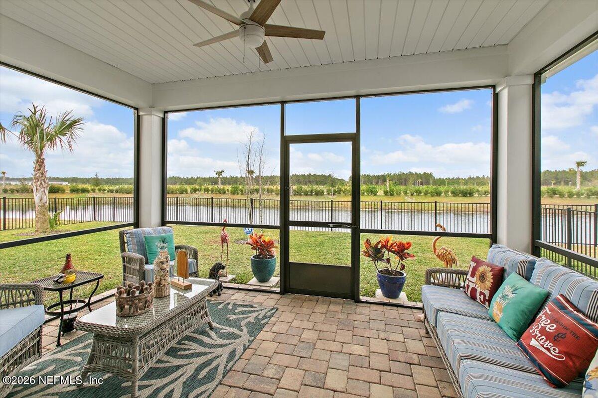 100 Simonson Run St. Augustine, FL 32092 - Photo 25 of 30 a living room with furniture and floor to ceiling windows