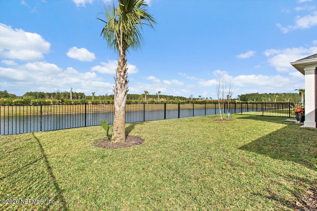 100 Simonson Run St. Augustine, FL 32092 - Photo 26 of 30 a view of a lake with a house in the background