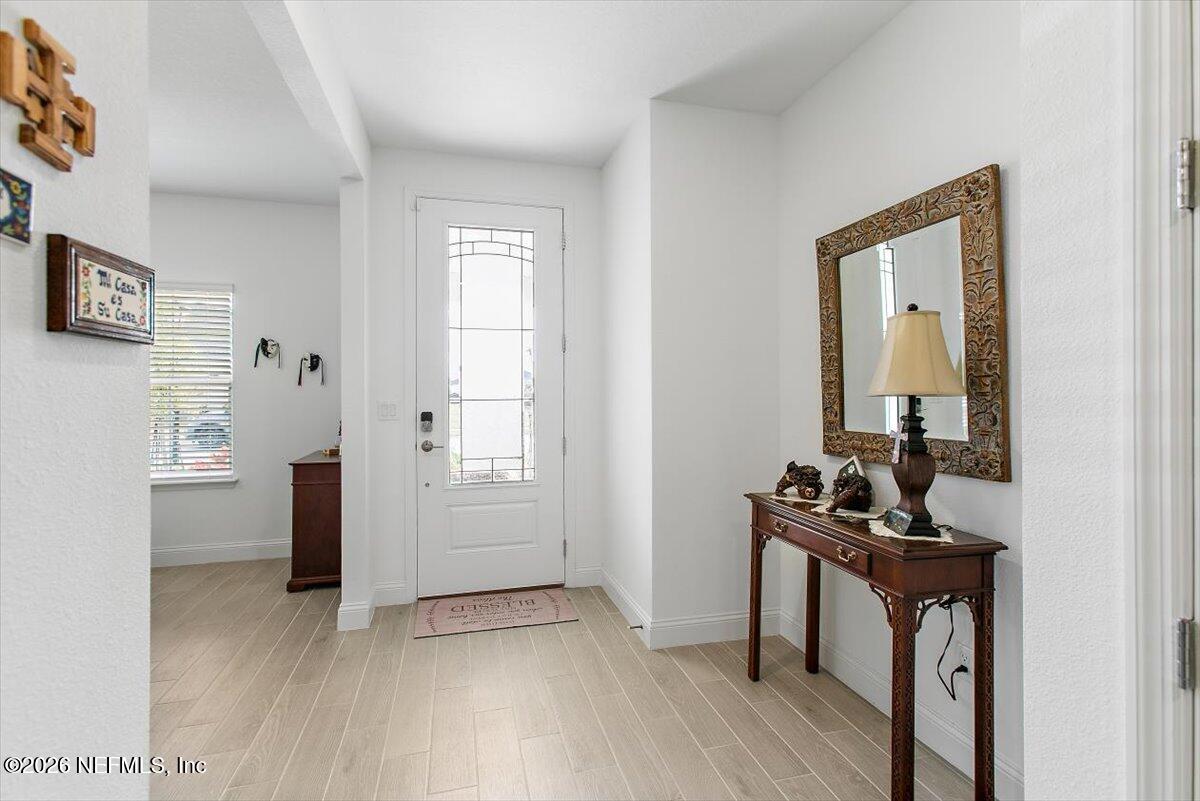 100 Simonson Run St. Augustine, FL 32092 - Photo 6 of 30 a view of a livingroom with furniture and hardwood floor