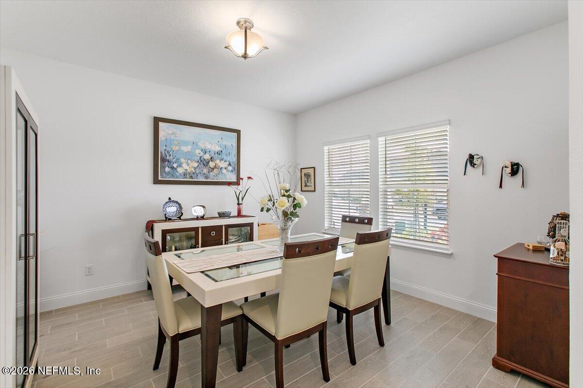 100 Simonson Run St. Augustine, FL 32092 - Photo 7 of 30 a view of a dining room with furniture and a window