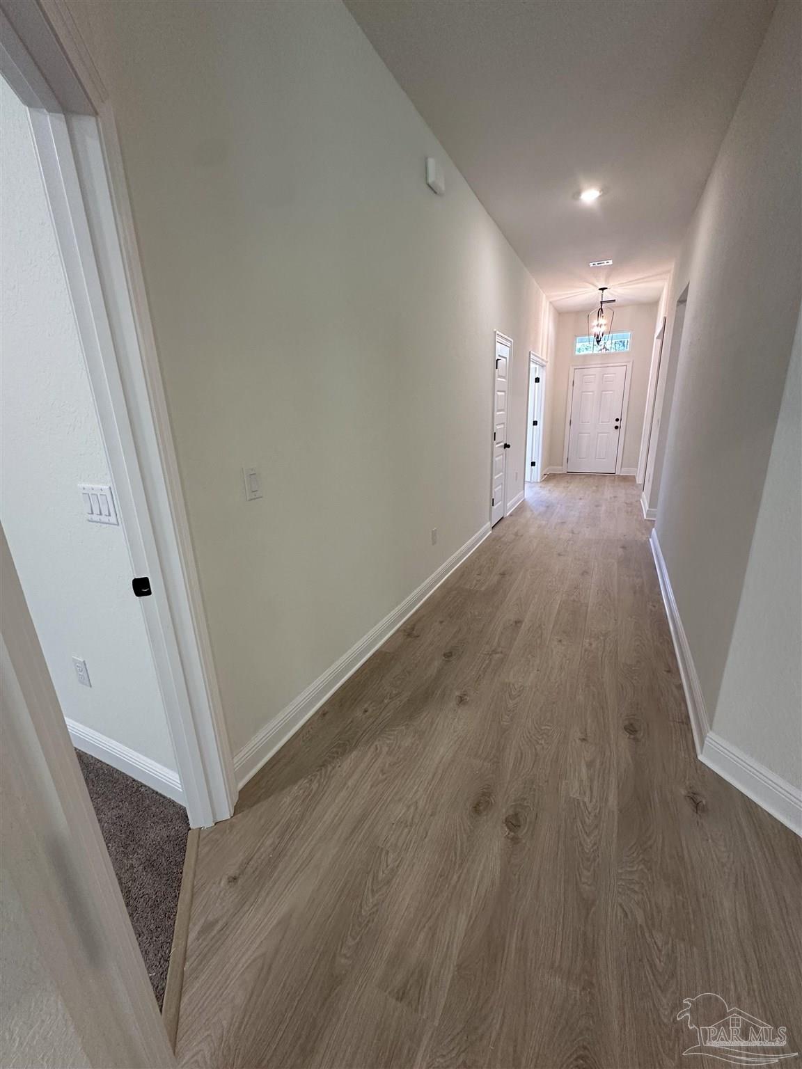 5223 Wahoo Road Milton, FL 32583 - Photo 25 of 26 a view of hallway with wooden floor