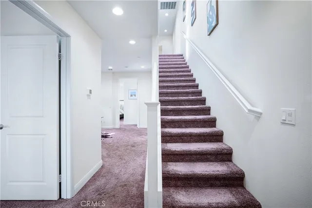 a living room with furniture potted plant and window