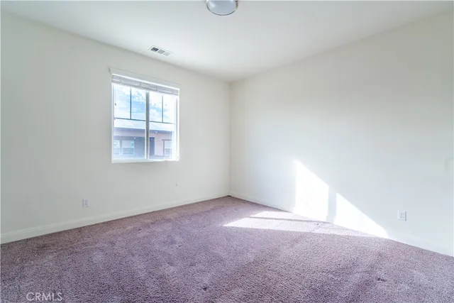a view of a hallway with a tv
