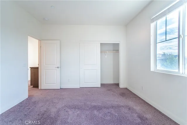 a view of a entrance gate of house and trees