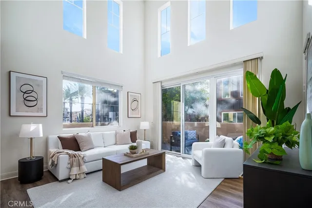 a living room with furniture plant and a potted plant