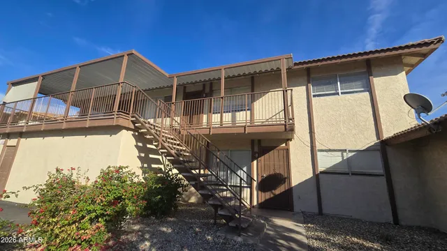 a view of a house with a tree
