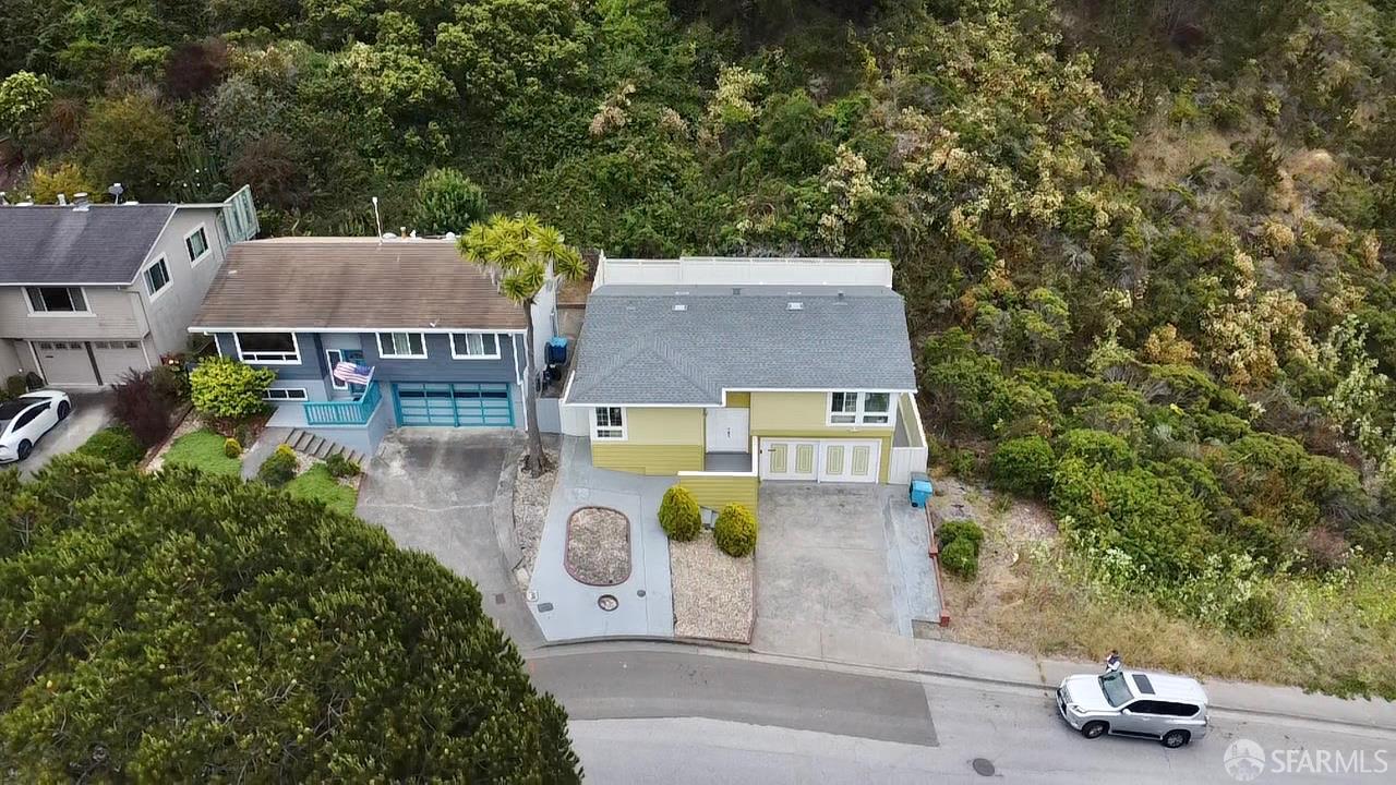 949 Yosemite Drive Pacifica, CA 94044 - Photo 2 of 2 an aerial view of a house with yard swimming pool and outdoor seating