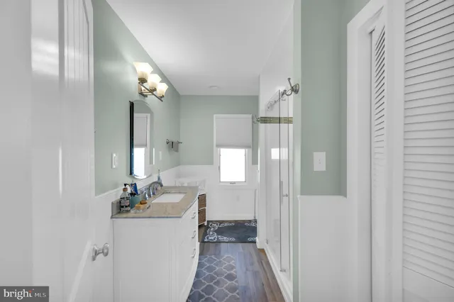 a view of a door and a yard from a balcony