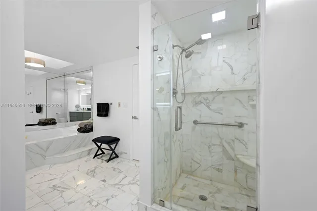 a bathroom with a shower sink and mirror