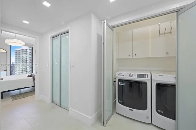 a utility room with washer and dryer
