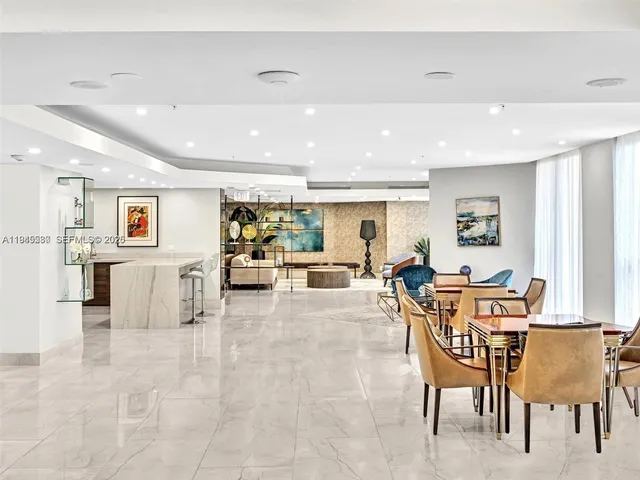 a living room with furniture and white walls