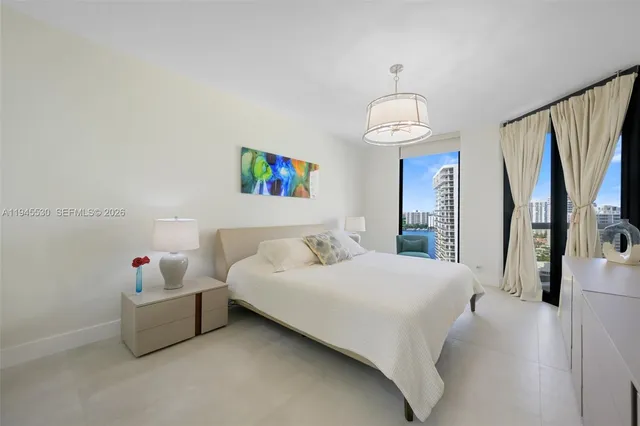 a bedroom with a bed furniture and a window