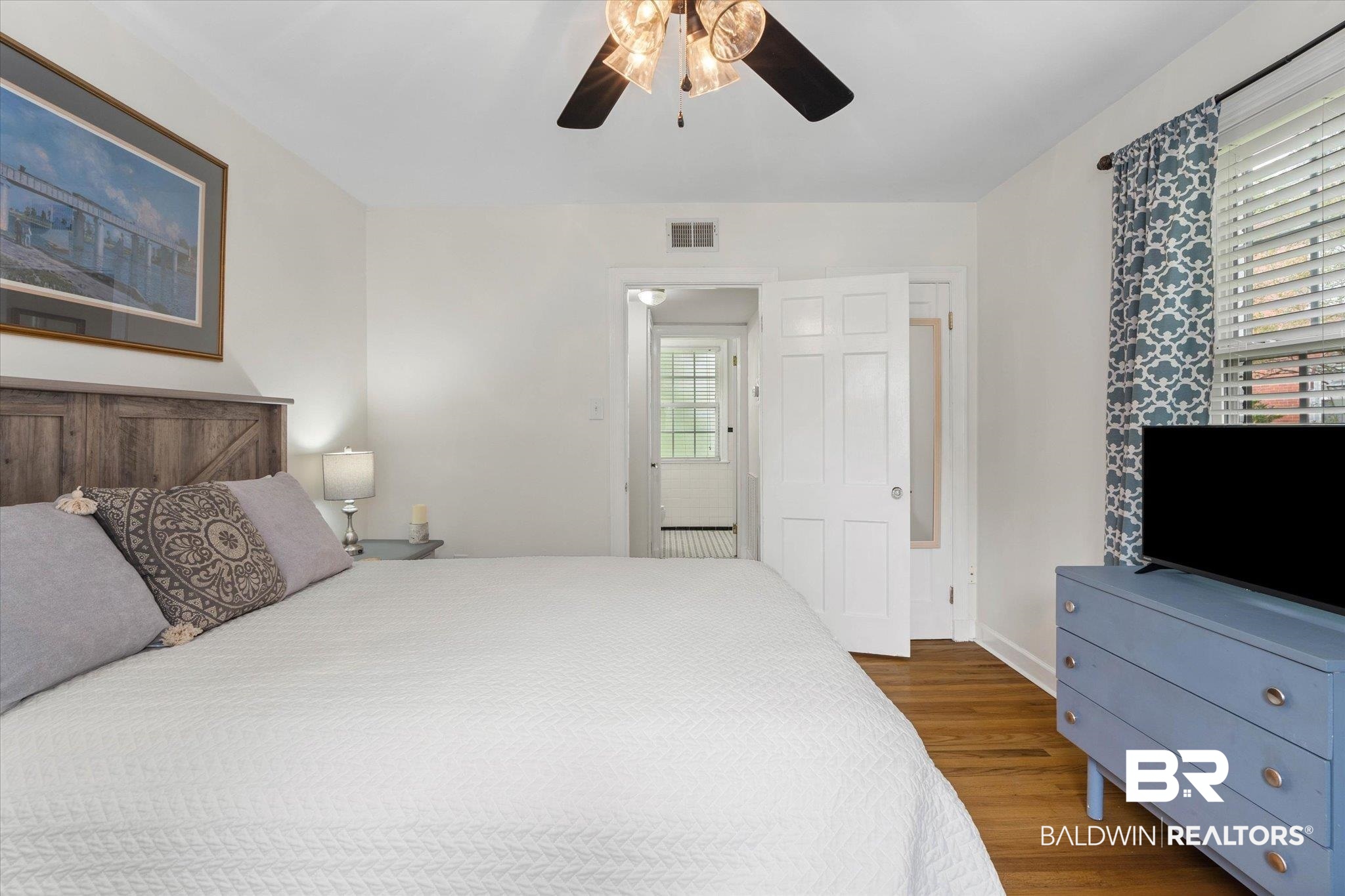 214 Upham Street, Unit 18A Mobile, AL 36607 - Photo 16 of 29 Bedroom featuring wood finished floors and ceiling fan