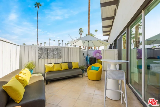 a terrace view with sitting space and seating space