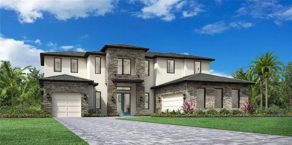 a front view of a house with a garden and plants