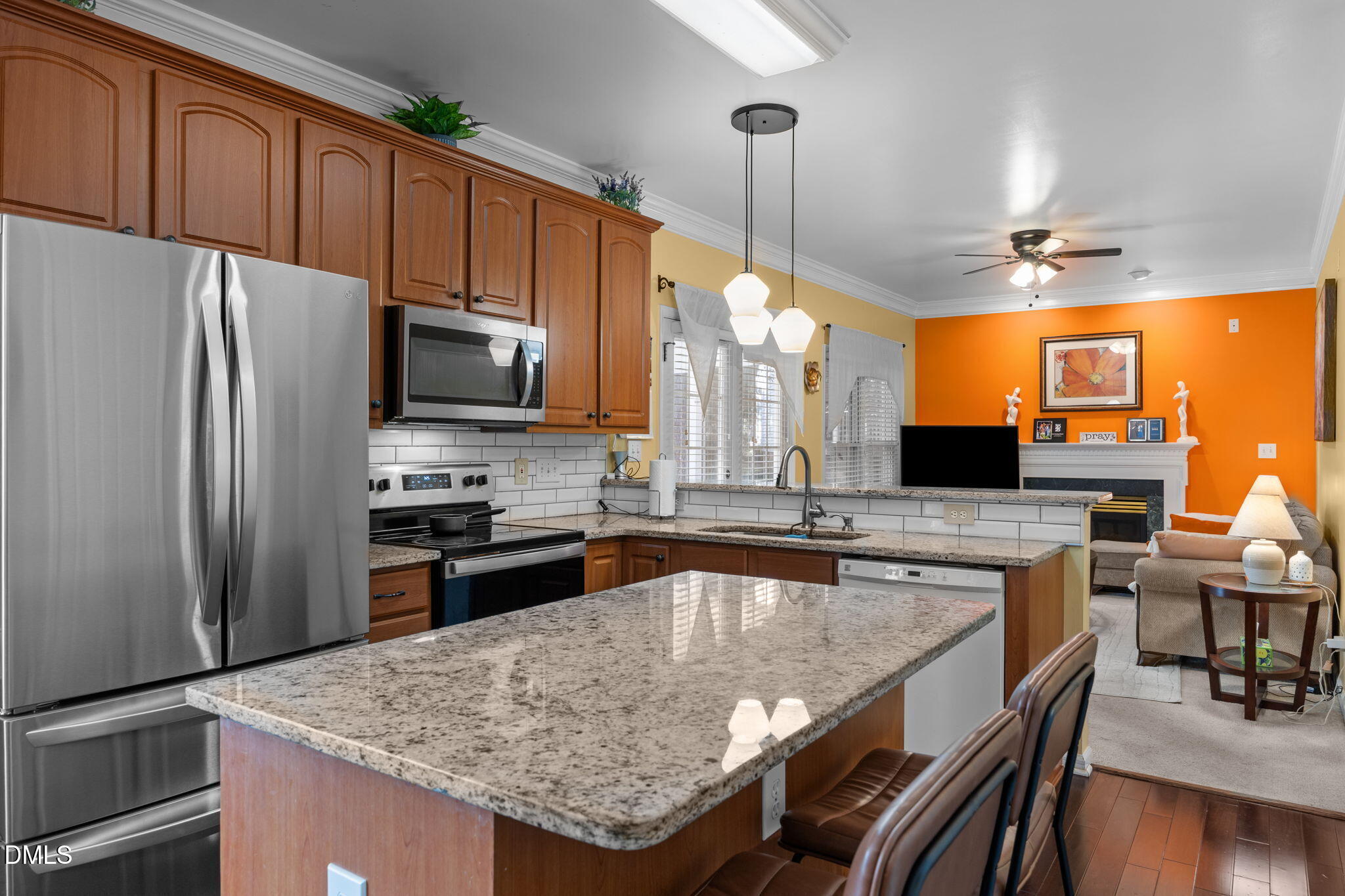 1758 Rowsby Court Wake Forest, NC 27587 - Photo 11 of 48 a kitchen with stainless steel appliances granite countertop a stove refrigerator sink and microwave