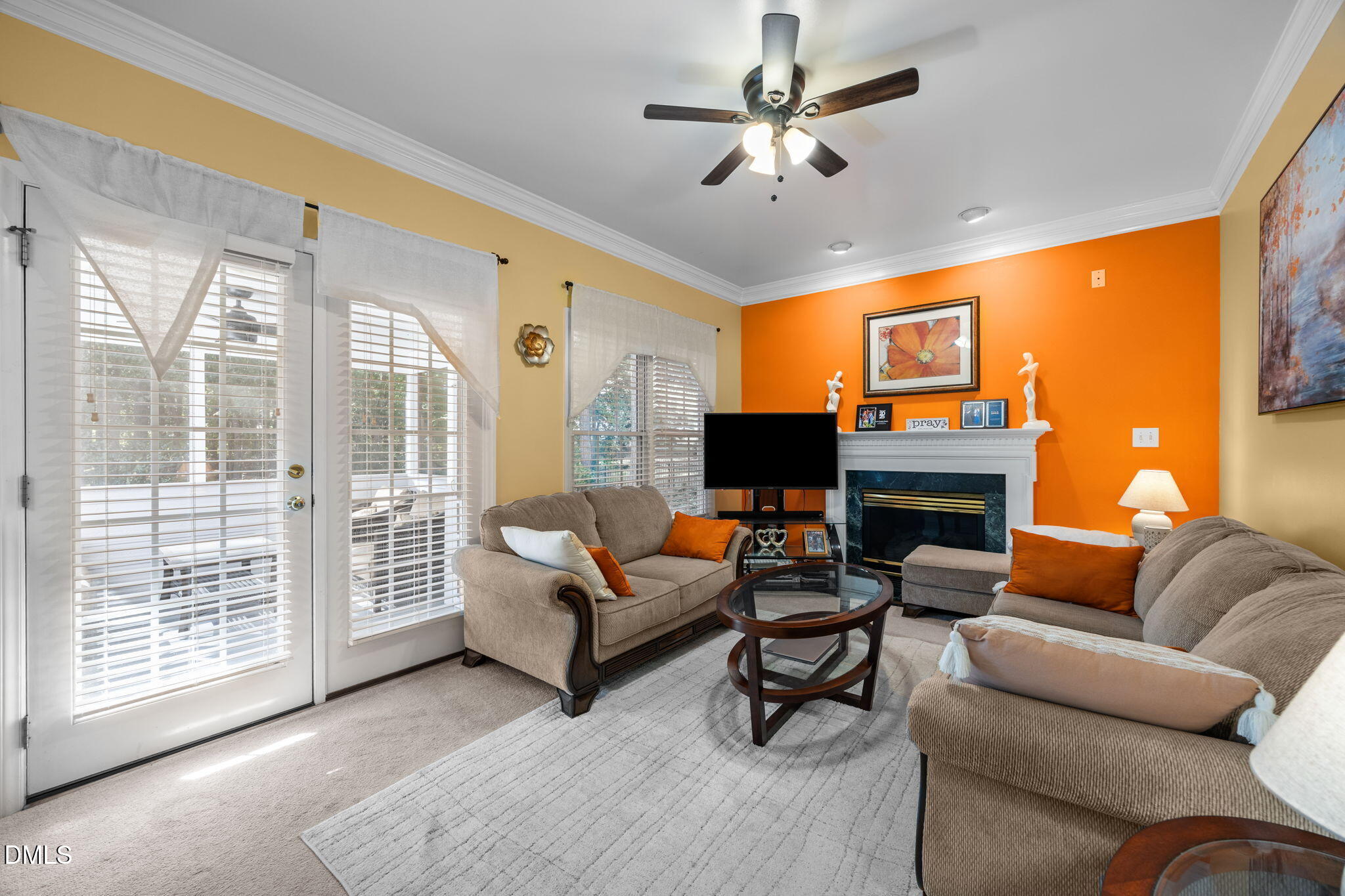 1758 Rowsby Court Wake Forest, NC 27587 - Photo 15 of 48 a living room with furniture a fireplace and a flat screen tv